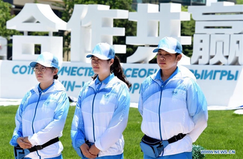 Volunteers seen on street in host city of 18th SCO Qingdao Summit