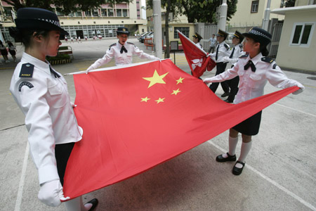 Students rehearse raising national flag