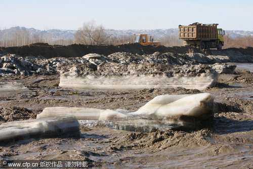 Blowing up ice to help river flow