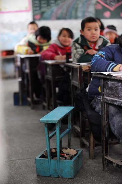 Pupils take up books, pens, and hand-stoves