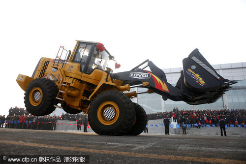 Loader performs break-dance stunts