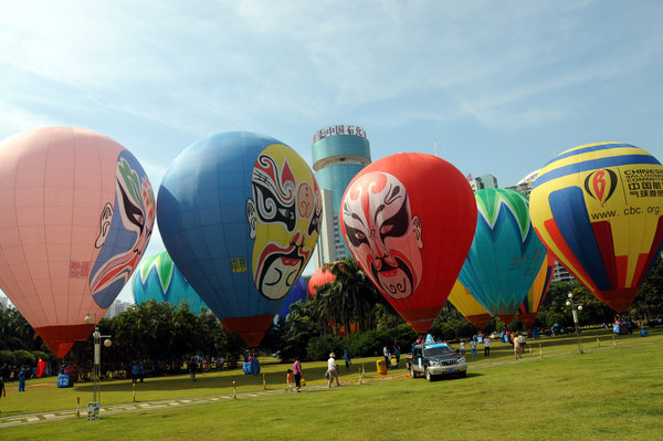 Hot air balloons color S China city sky