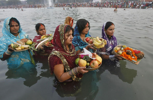 Hindu devotees pray to Sun god