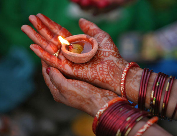 Hindu devotees pray to Sun god