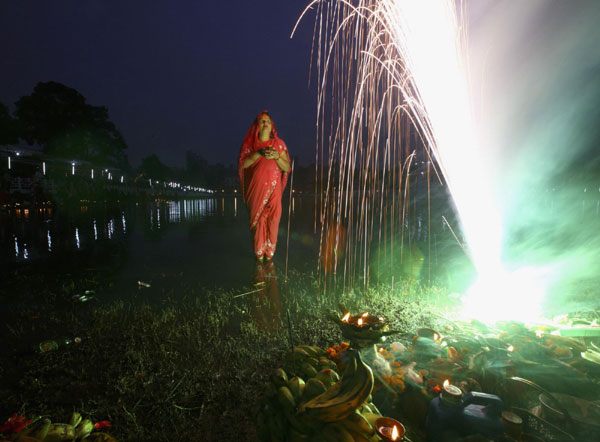 Hindu devotees pray to Sun god