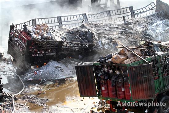 One dead after eight trucks blaze