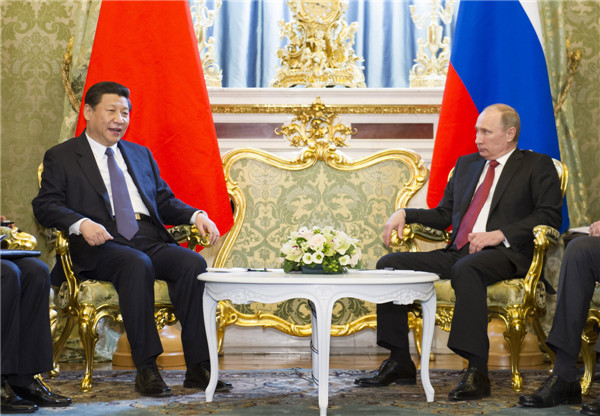 Visiting Chinese President Xi welcomed by Putin