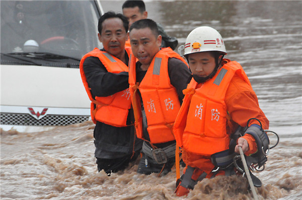 Rain-triggered flood hits SW China