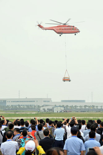 Helicopters practice acrobatic moves for expo