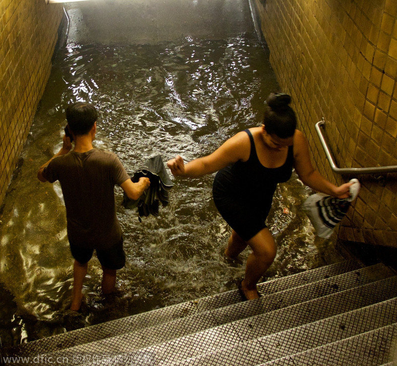 Heavy rain, floods swamp NYC metro stations