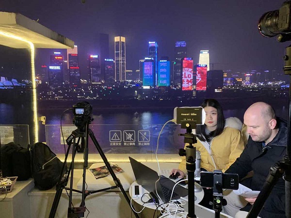 TV trailer plays across Chongqing skyscrapers