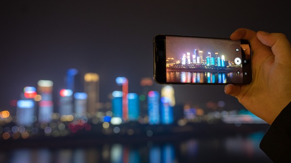 TV trailer plays across Chongqing skyscrapers