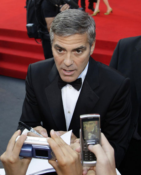 George Clooney and his girlfriend on red carpet at 66th Venice Film Festival