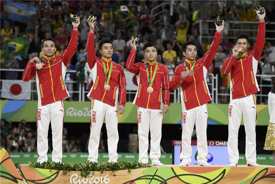 Chinese gymnasts win bronze in men's final, Japan crown