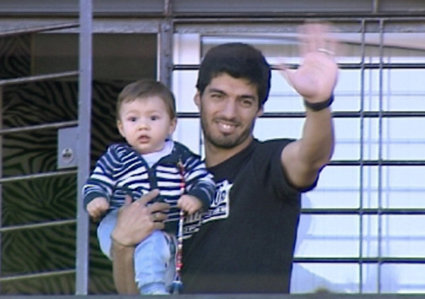 Luis Suarez receives a hero's welcome at home