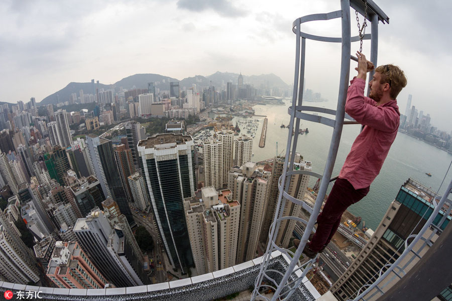 Daredevil thrill-seekers on top of Hong Kong