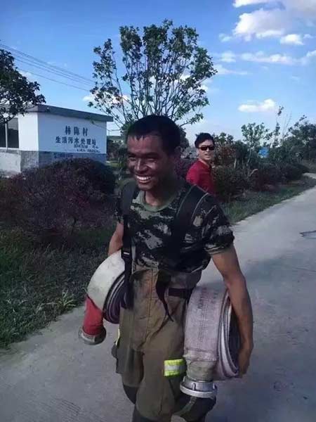 Smile of a hard-working firefighter lights up internet