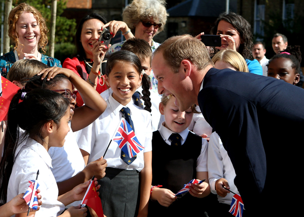 Prince William arrives in China to warm welcome