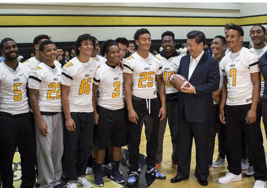 Xi gets high school jersey, invites 100 students to China