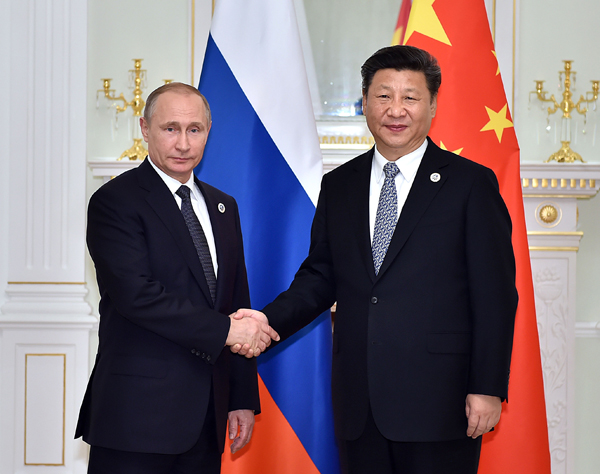 Xi, Putin meet on promoting SCO's regional role