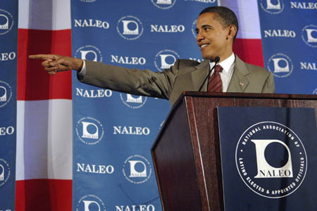 U.S. Democratic presidential candidate Senator Barack Obama (D-IL) recognizes a friend in the audience as he addresses a National Association of Latino Elected and Appointed Officials (NALEO) conference in Washington, June 28, 2008.