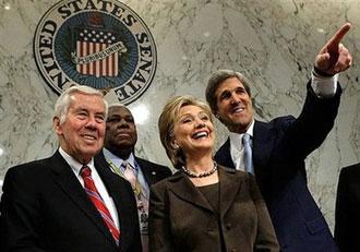 US Secretary of State Nominee Hillary Clinton (3rdL) arrives at her confirmation hearing before the Senate Foreign Relations Committee as she is flanked by Senator Richard Lugar (L) and Senator John Kerry (R) on Capitol Hill in Washington, DC.(AFP/Getty Images/Alex Wong)