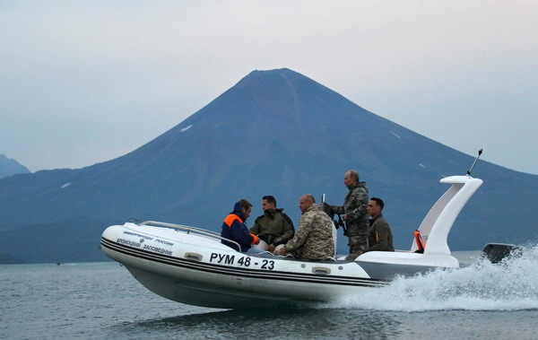 Russia's Putin braves rough seas to study whales