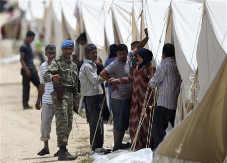 Syrian forces take border town as inhabitants flee