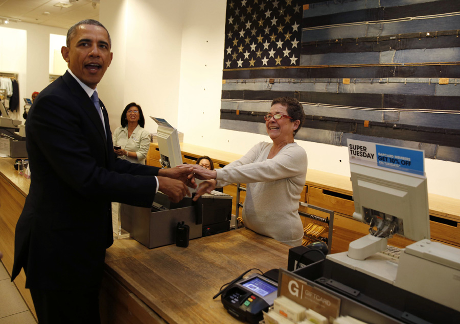 Obama sweats over sweaters during NY shopping stop