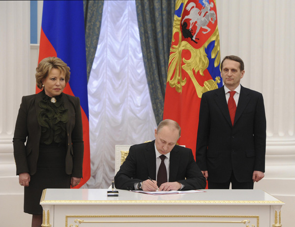 Putin signs law on Crimea accession