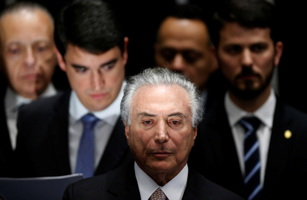 Temer sworn in as president of Brazil, Rousseff vows resistance