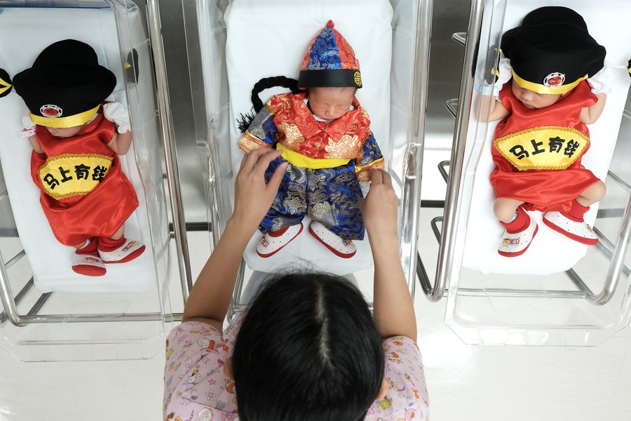 Newborn babies in Bangkok ring in CNY with chicken costumes