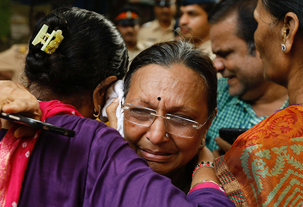 Stampede on crowded Indian pedestrian bridge leaves 22 dead