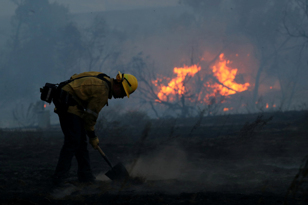 10 dead, 50 reported missing in massive California wildfires