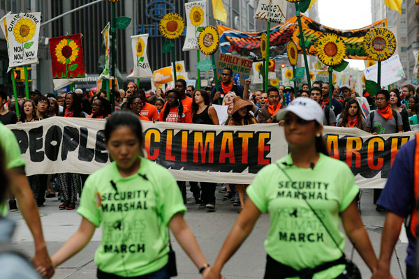 Tens of thousands crowd New York streets for climate march